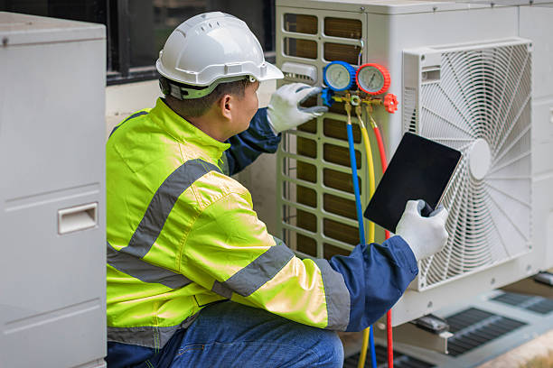 Professional Air Conditioning Repair technician working in Lohman, MO
